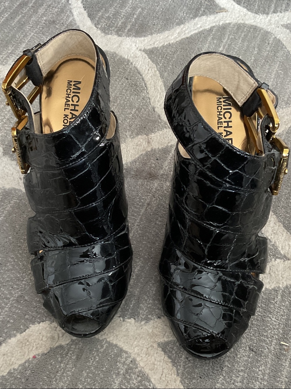 Stylish black leather high heel shoes. Micheal Kors. Sole slightly worn.